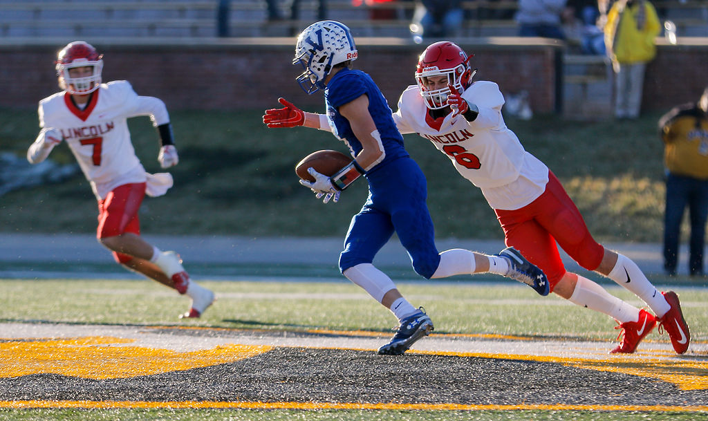 Valle wide receiver Drew Bauman tries to evade a tackle